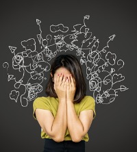 A woman holding her hands to her face, having trouble with Stress Management in Peoria IL