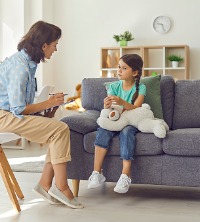 A counselor talking with a child during Parenting Allocation Evaluations in Peoria IL