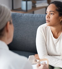 A client sitting with a counselor, discussing their Sexuality in Peoria IL