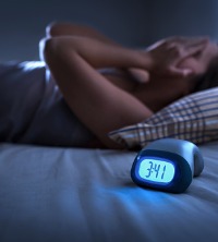 A person not able to sleep, having trouble with Insomnia and Sleep Hygiene in Peoria IL
