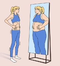 Skinny woman who has Eating Disorders in Peoria IL, looking in a mirror and seeing a larger image of herself