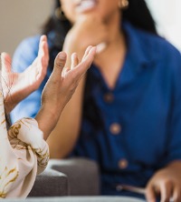 Woman discussing Assertiveness Training in Peoria IL with a counselor