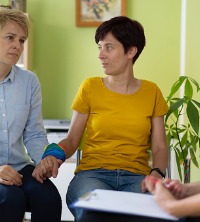 A same-sex couple in therapy, discussing LGBTQ Concerns in Peoria IL