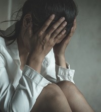 Woman struggling while going through Abuse and Trauma Recovery